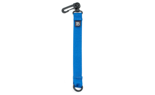 An 8-inch Island (blue) Key Strap with a snaphook at one end and an o-ring at the other.